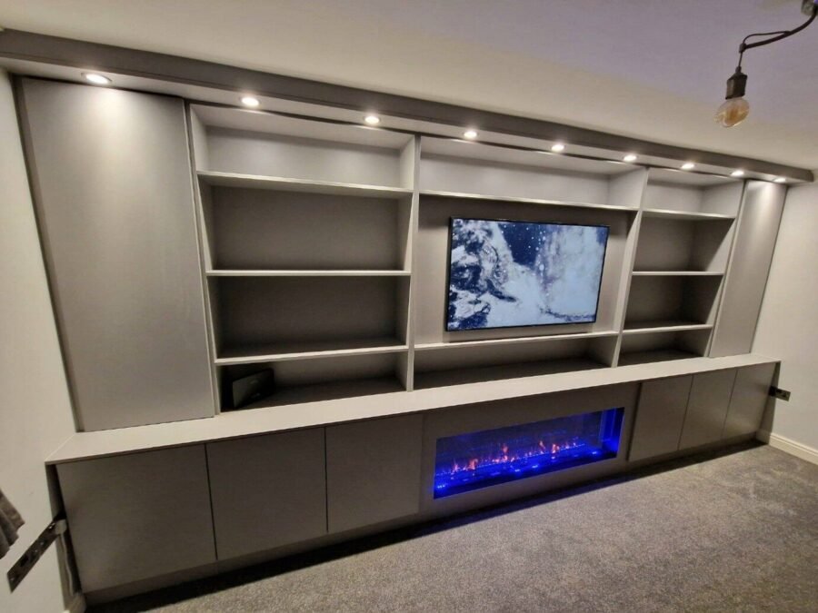 Media wall with fireplace in Warrington with a recessed TV and an inset electric fire